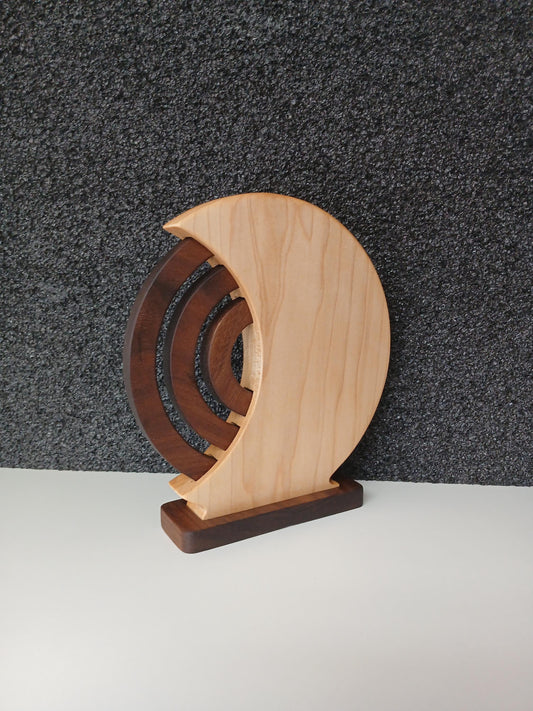 Wooden Perpetual Calendar with Maple shell and walnut rings and base. Beautiful home decor made in Taos New Mexico in the United States. Finished with natural oil and beeswax, viewed from the back side