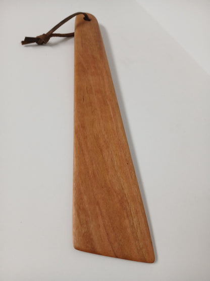 Hardwood Cooking Utensil for scraping and turning, handmade and finished with food safe oil and a leather strand. shown from above 