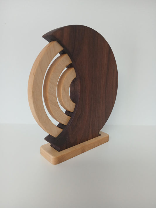 Dark Walnut Desk Calendar with Hard Maple Rings and Base. Beautifully finished and functional home decor piece. Shown from the back side