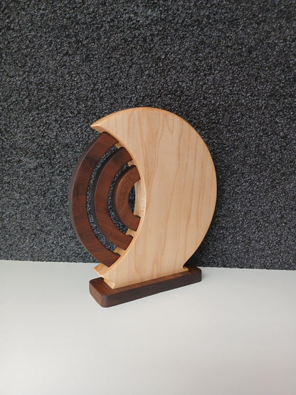 Wooden Perpetual Calendar with Maple shell and walnut rings and base. Beautiful home decor made in Taos New Mexico in the United States. Finished with natural oil and beeswax, viewed from the back side